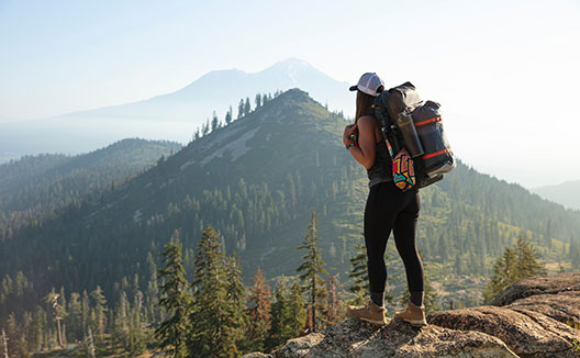 hiker at the top of a mountain